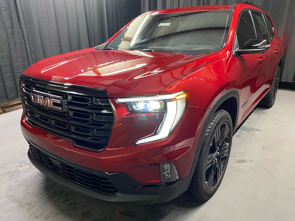 2025 GMC Acadia Elevation in Volcanic Red Tintcoat — front three-quarter view