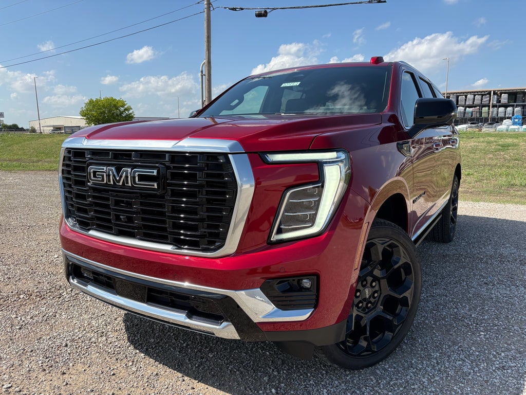 2026 GMC Yukon Denali in Volcanic Red Tintcoat — front three-quarter view