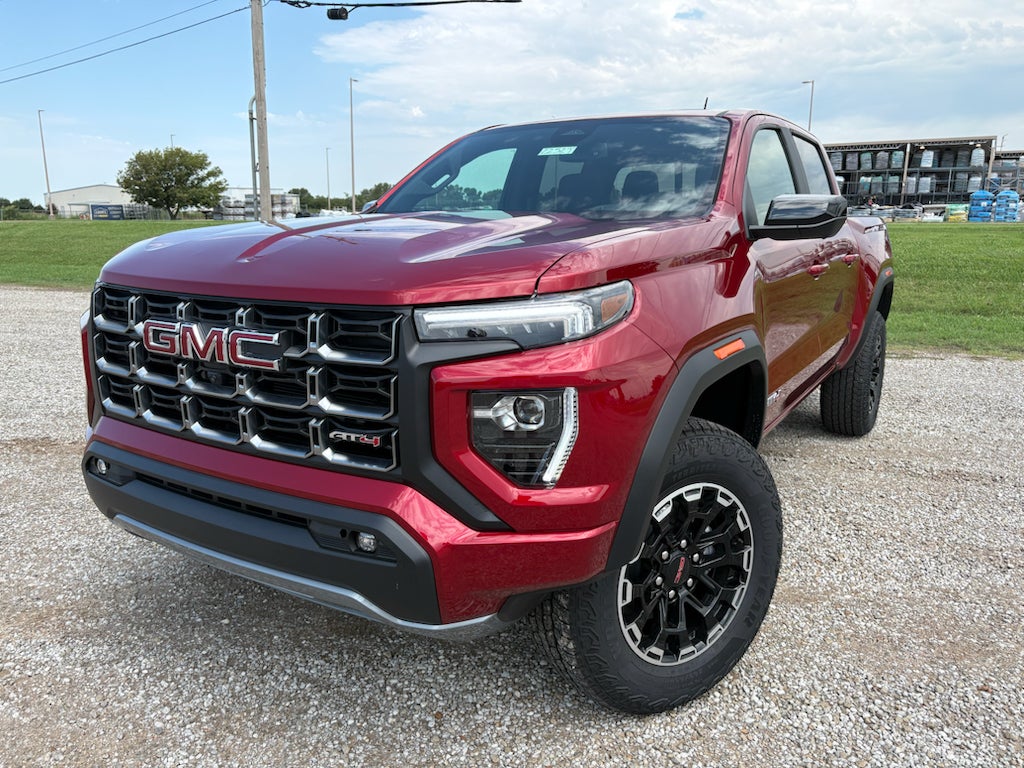 2026 GMC Canyon AT4 in Volcanic Red Tintcoat — front three-quarter view
